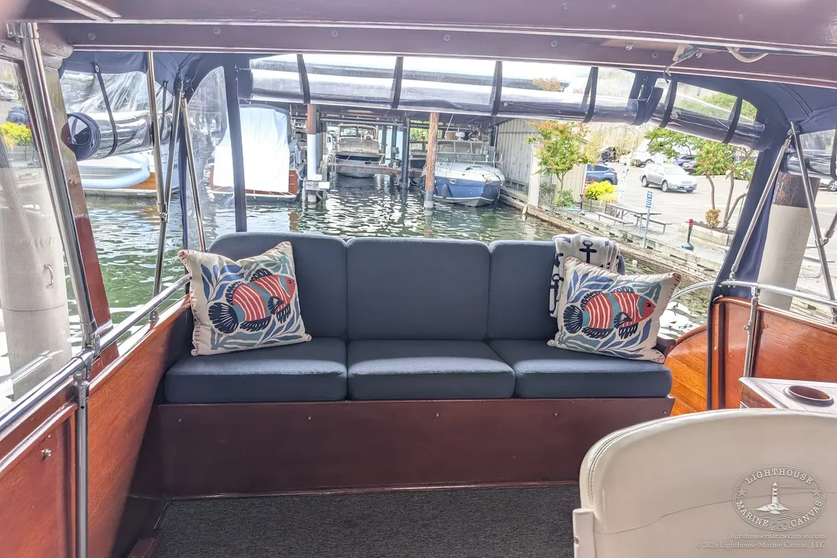 The flybridge aft settee with its six new cushions in Sunbrella Upholstery Heritage Indigo.