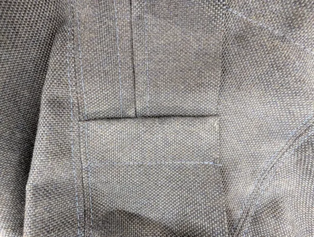 Cushion cover detail: a zipper placket to hide the ends of the zipper cleanly.